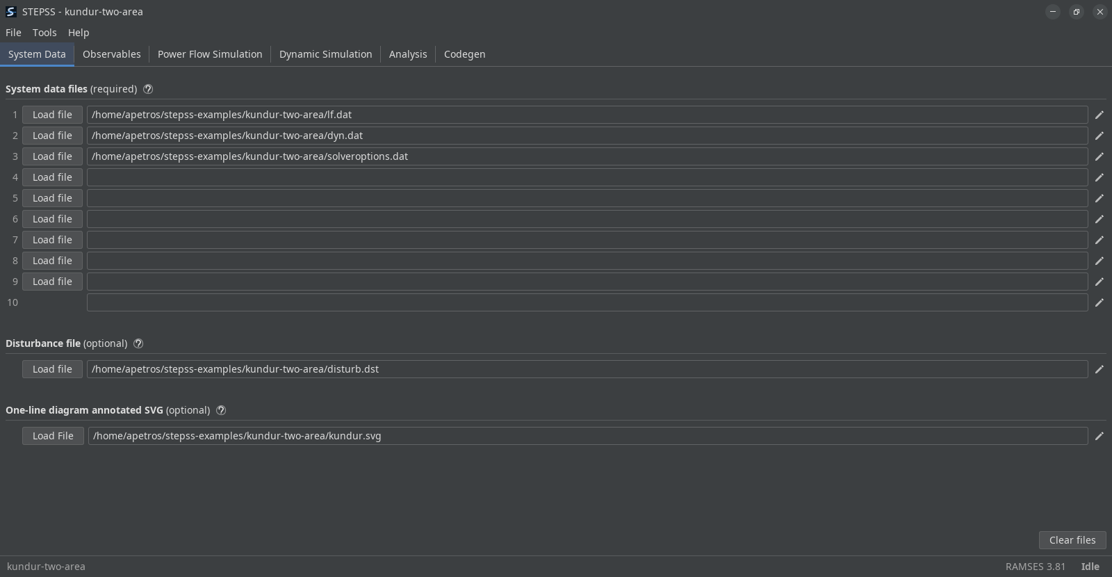 The System Data tab immediately after opening the Kundur two-area example. A banner across the top reads Kundur two-area opened in, followed by the path under the examples directory, with Open folder and Dismiss at its right. Below it the first three system data rows hold lf.dat, dyn.dat and solveroptions.dat, the disturbance row holds disturb.dst, and the one-line diagram row holds kundur.svg.